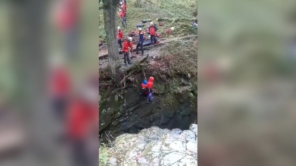 The man was lifted to safety by a rigged rope system
