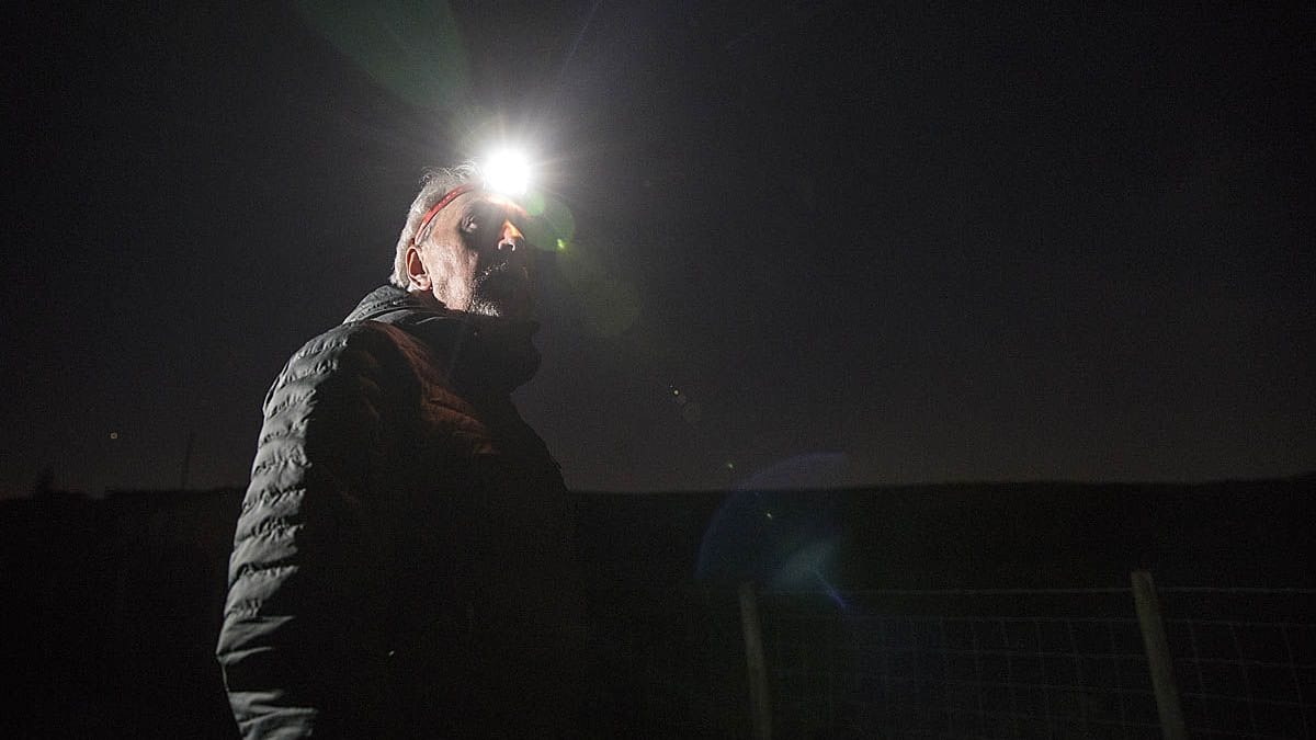 A walker uses a headtorch at night. Photo: Bob Smith/grough