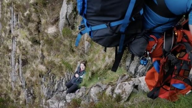 Kitty Harrison waits on a tiny precipice, with a sheer drop below, as the rescuers try to reach her. Photograph: Darlun/BBC