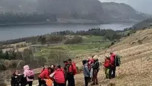 Keswick MRT helping injured woman on the path up Helvellyn from Swirls car park