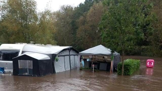A flooded caravan on the site.