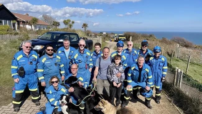 coastguard rescues and man with his son and dogs