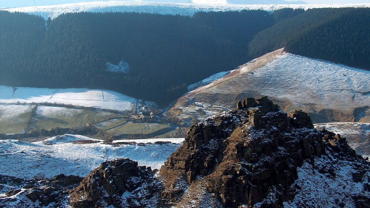 The Tower at Alport Castles with Alport in the valley