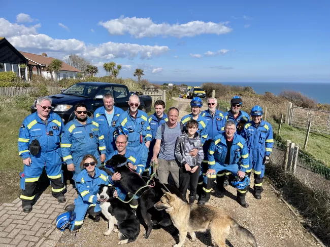 coastguard rescues and man with his son and dogs