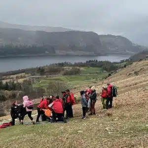 Keswick MRT helping injured woman on the path up Helvellyn from Swirls car park