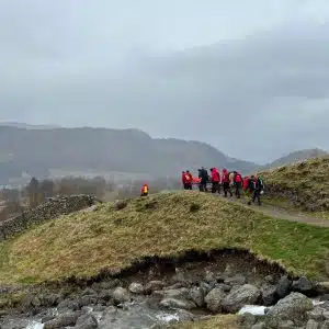 Injured woman being carried down